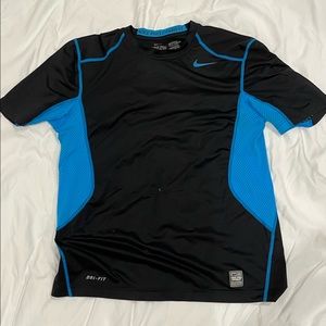 Nike pro combat shirt. Some wear and small stain on front